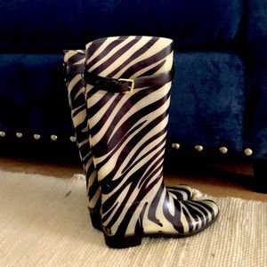 Brown and white zebra rain boots